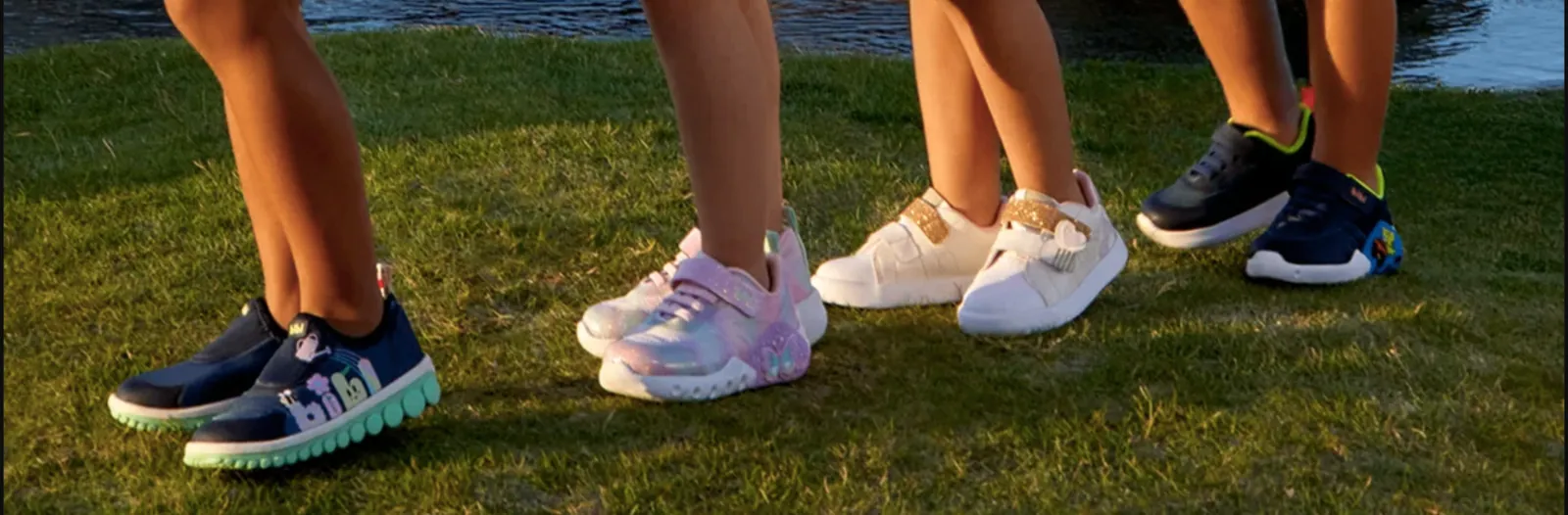 Kids wearing Bibi shoes on the grass